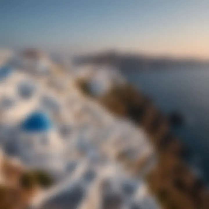 An aerial view of Santorini's iconic white buildings and blue rooftops.