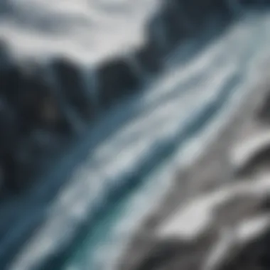 Aerial view of a melting glacier showcasing the stark contrast between ice and rocky terrain.